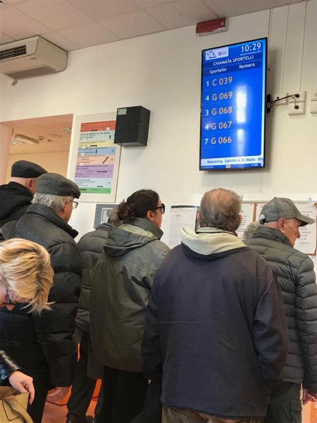 Italians queuing in a hospital